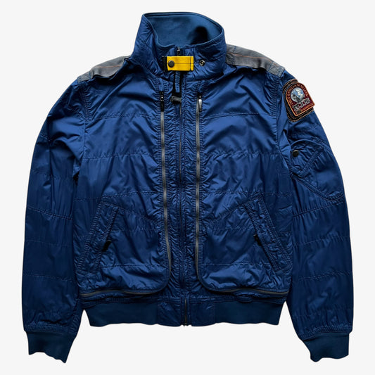 Vintage Y2K women's Parajumpers USAF 210 rescue squadron blue utility jacket.