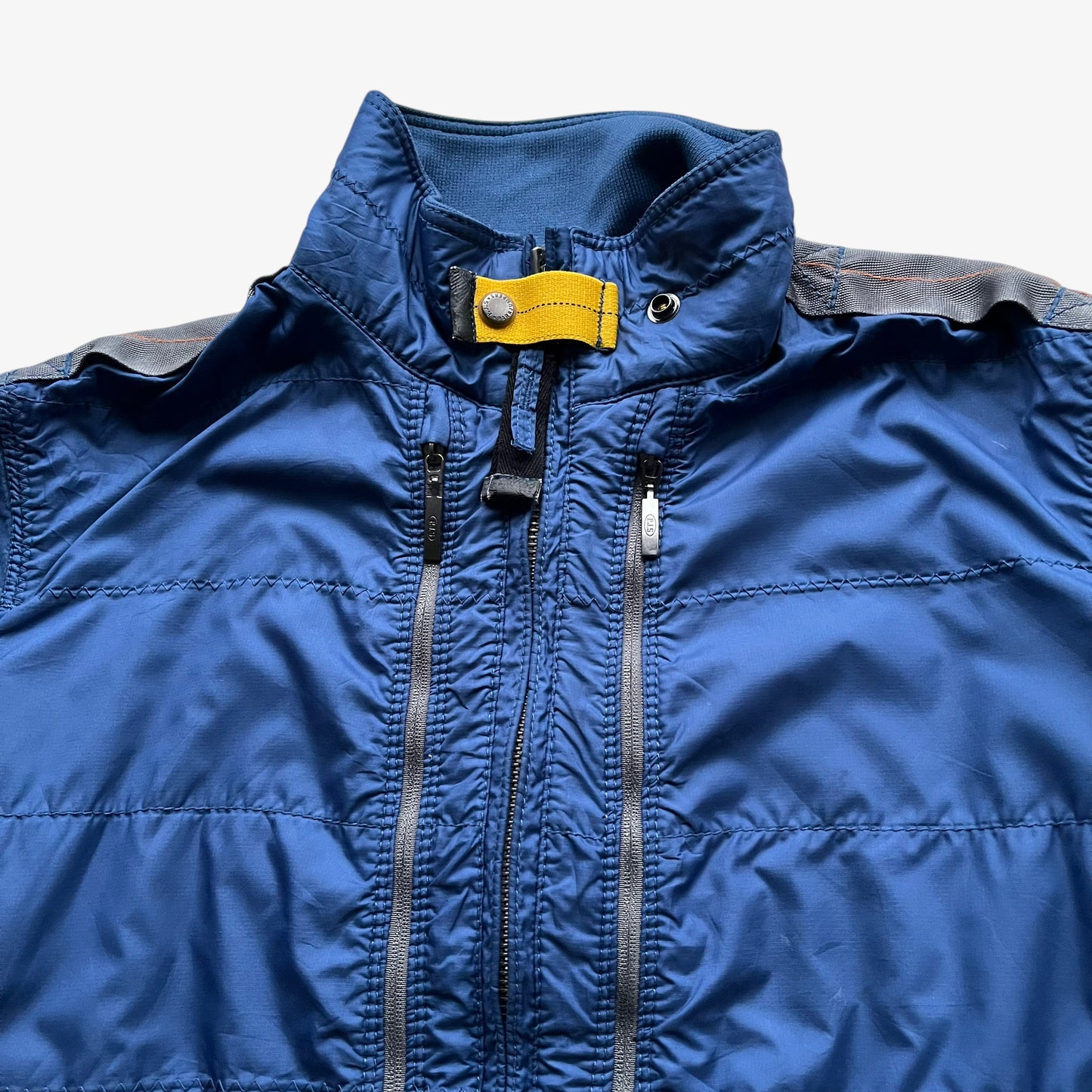 Collar of vintage Y2K women's Parajumpers USAF 210 rescue squadron blue utility jacket.