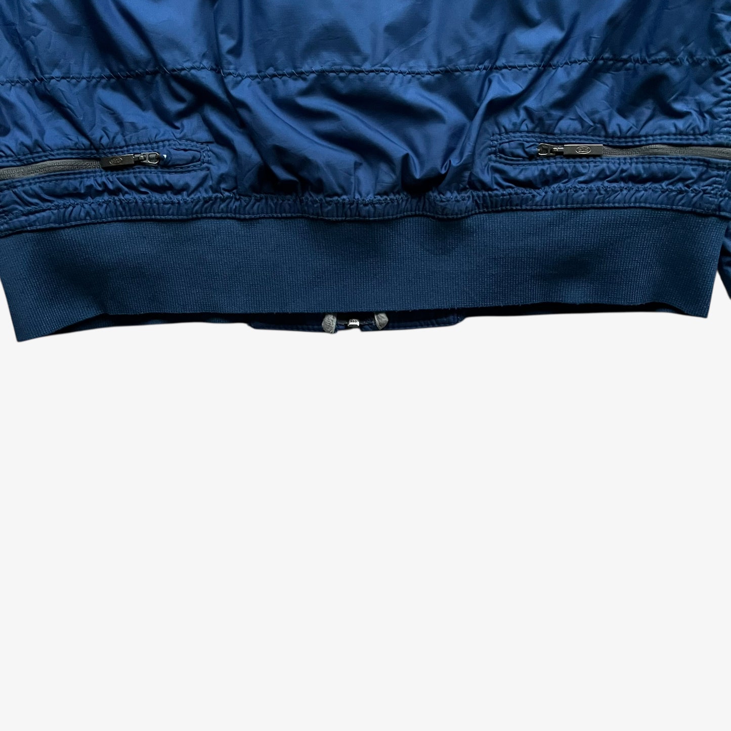 Hem of vintage Y2K women's Parajumpers USAF 210 rescue squadron blue utility jacket.