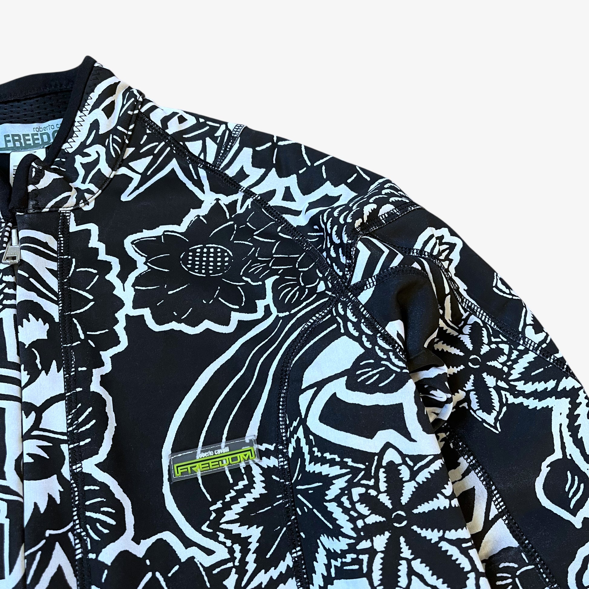 Roberto Cavalli Freedom logo embroidered on the chest of vintage Y2K women's abstract floral print black jacket.