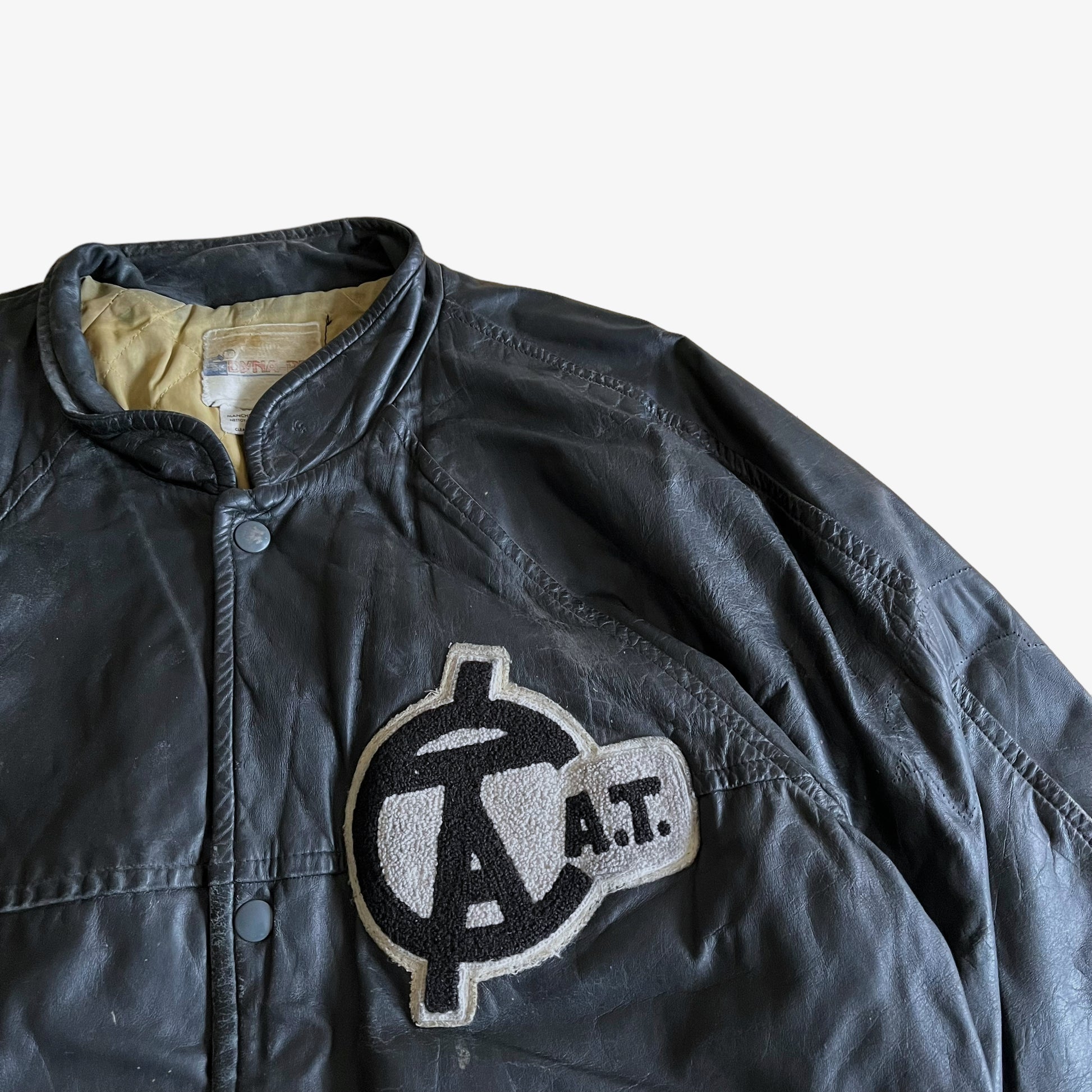 Vintage 80s CAT Finance Black Leather Varsity Jacket Crest - Casspios Dream
