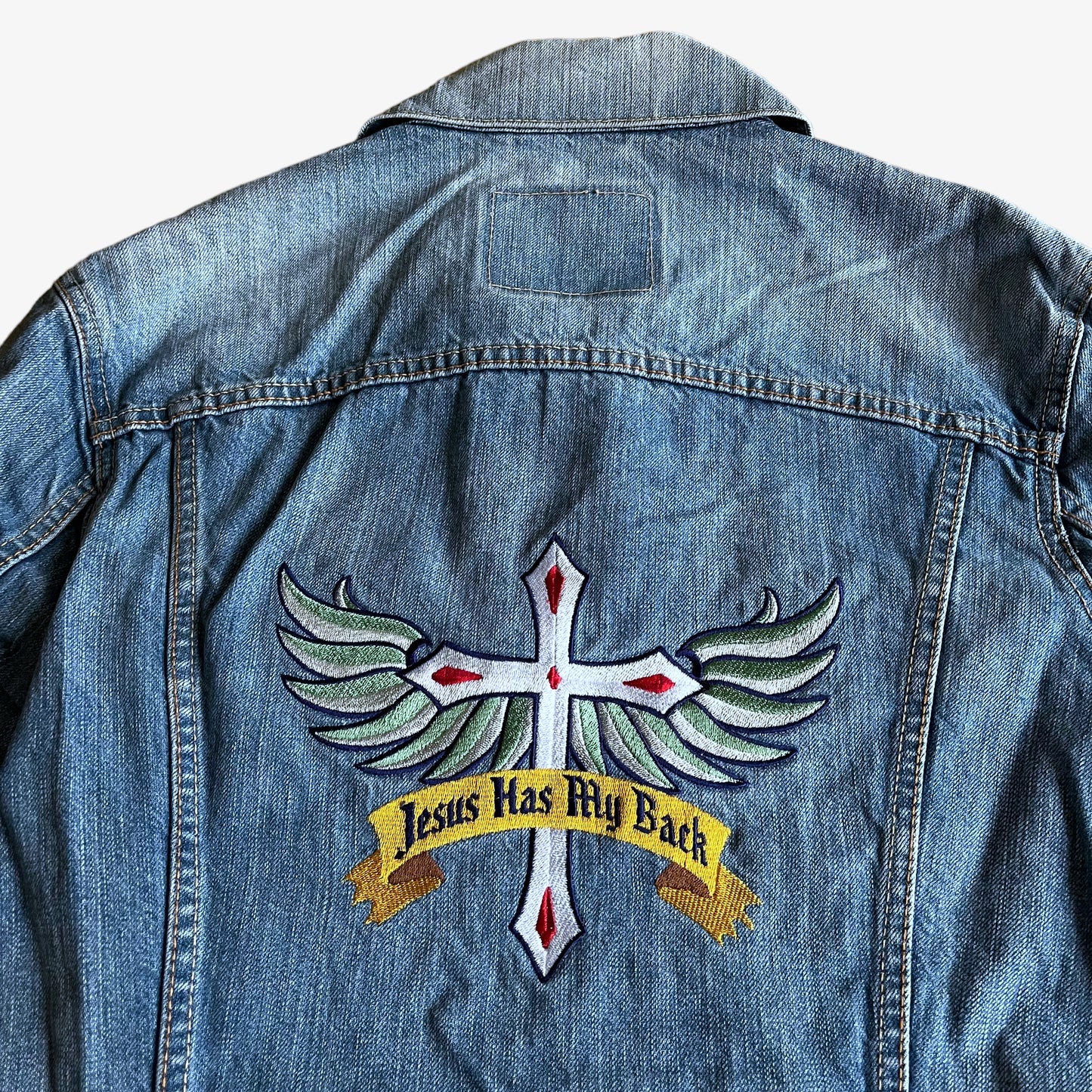 Vintage 90s Levis Jesus Christ Has My Back Embroidered Blue Denim Trucker Jacket Spell Out - Casspios Dream