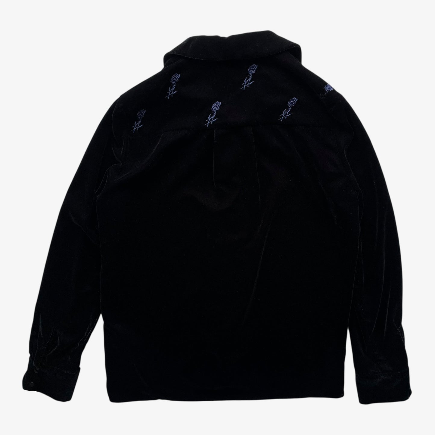 Back of women's Maje black velour shirt with embroidered floral details on a white background.
