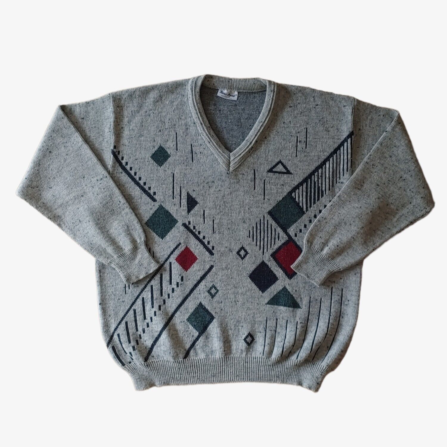 A vintage 90s men's Marc Rene abstract V-neck grey jumper with long sleeves, displaying geometric patterned design.