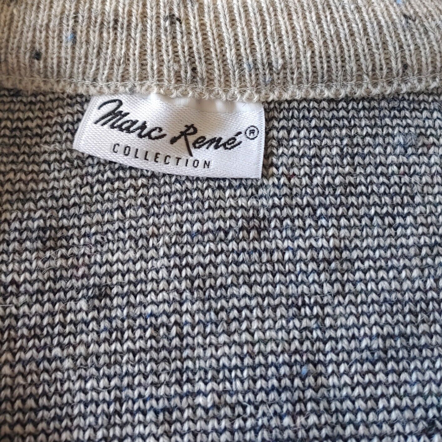 Label of vintage 90s men's Marc Rene abstract V-neck grey jumper.