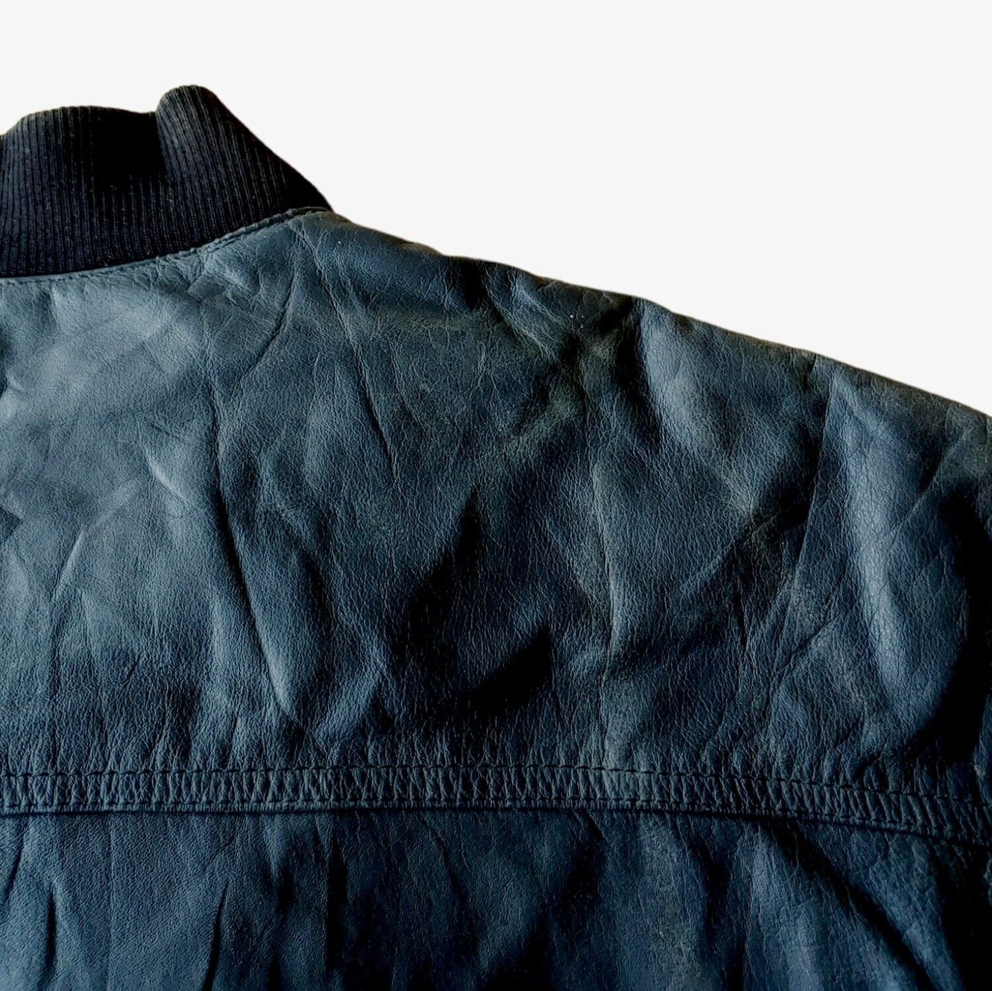 Back of vintage 90s Pepe 36 Championship navy leather varsity jacket.