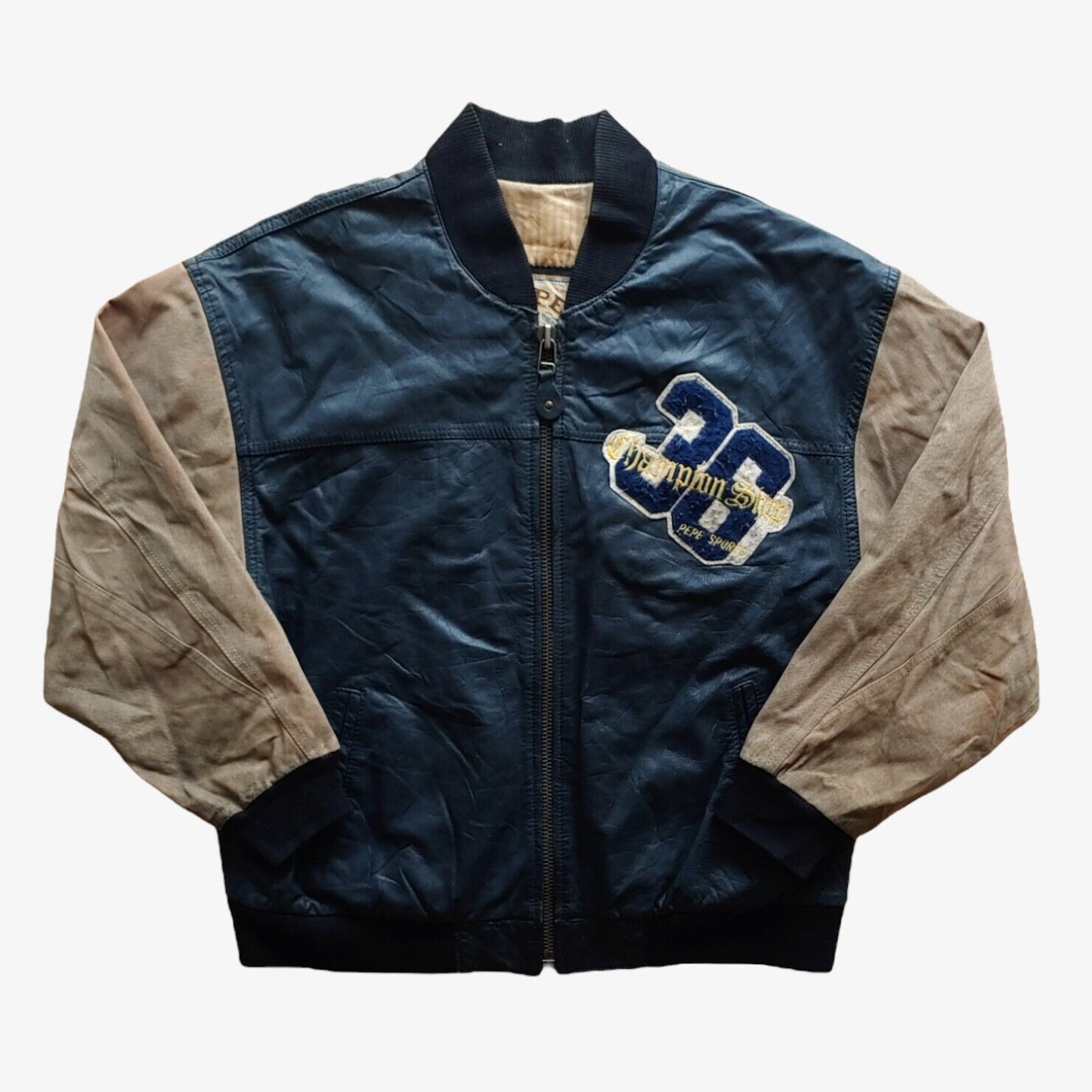 Vintage 90s Pepe 36 Championship navy leather varsity jacket with embroidered breast logo and letterman design.