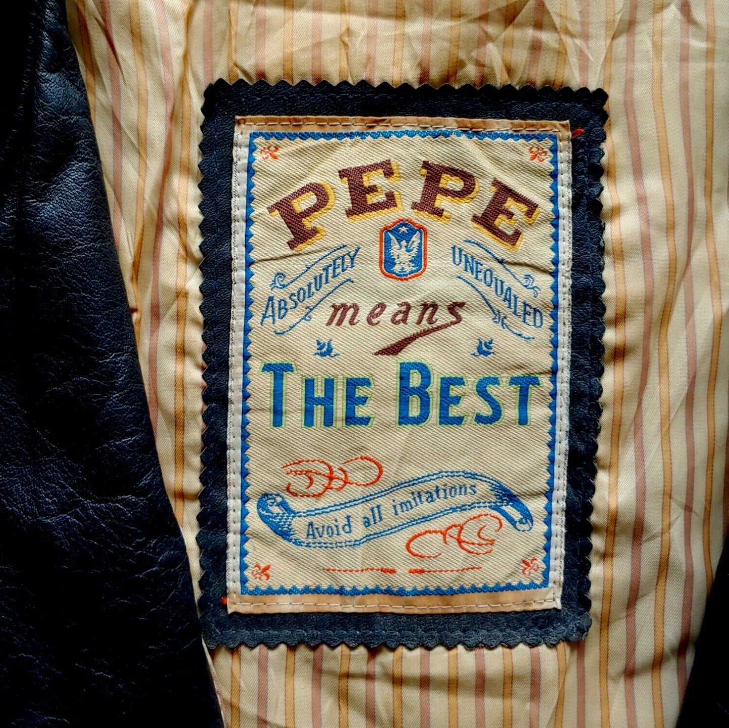 Label of vintage 90s Pepe 36 Championship navy leather varsity jacket.