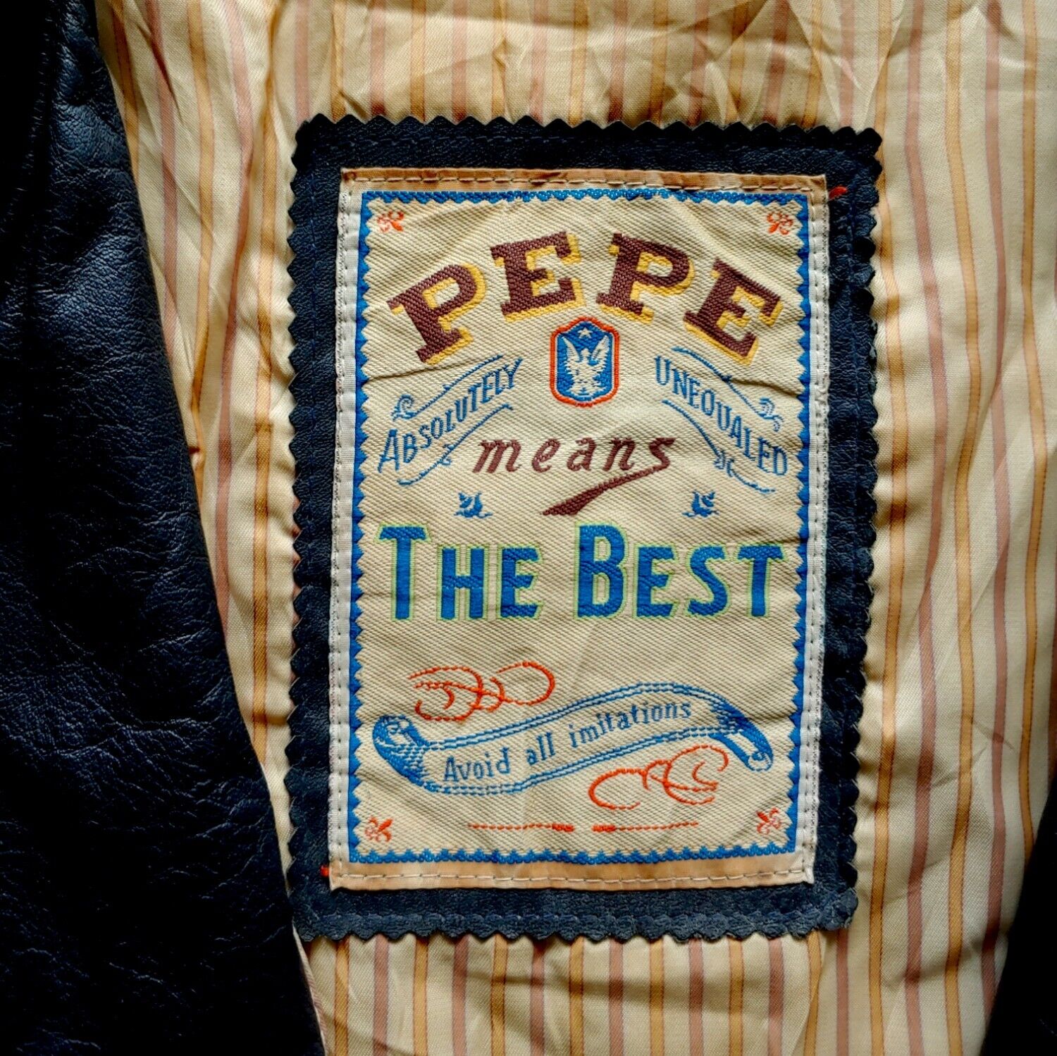 Label of vintage 90s Pepe 36 Championship navy leather varsity jacket.