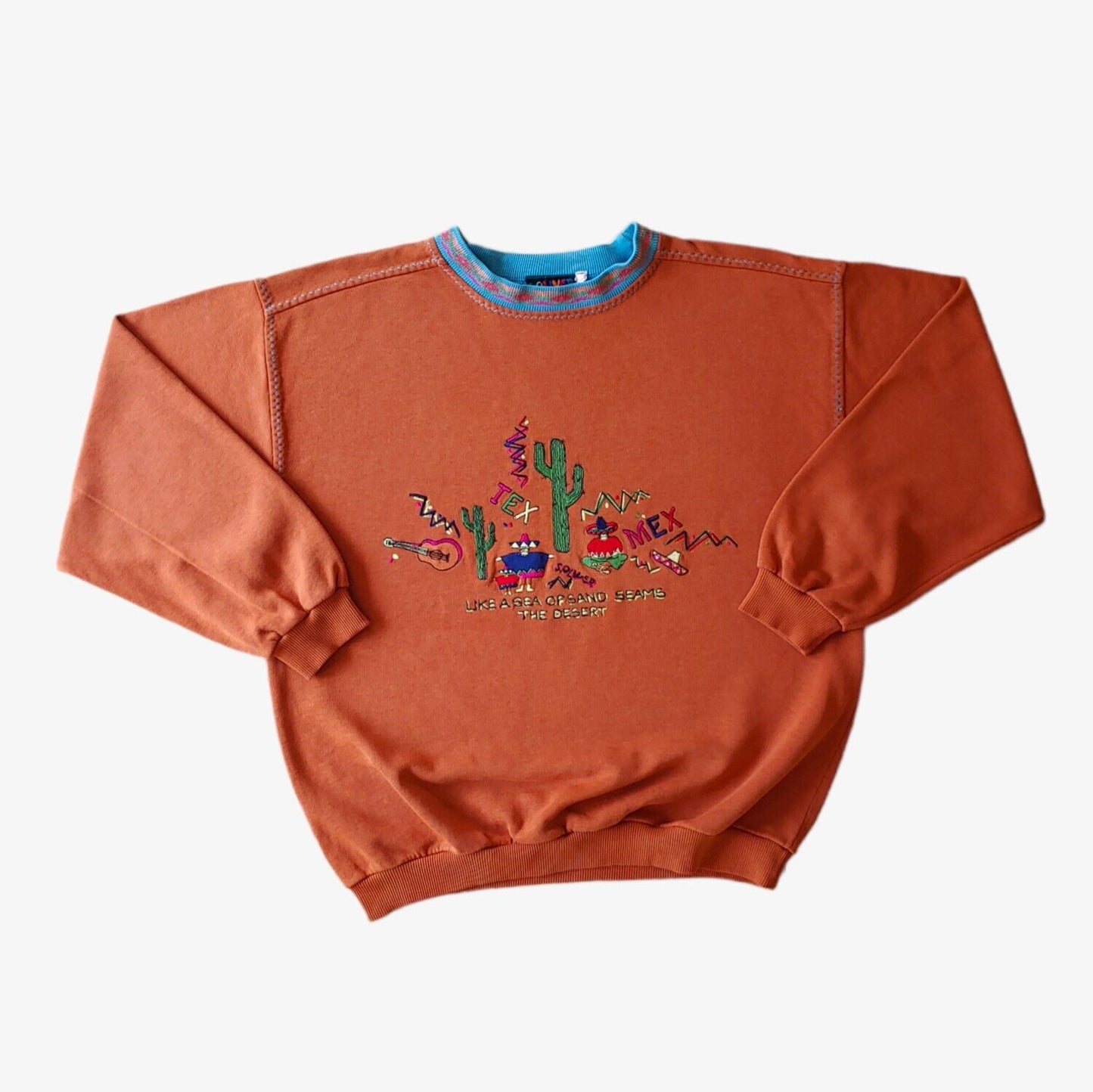 A vintage orange S.Oliver Mexico souvenir sweatshirt with a patterned collar and embroidered Tex Mex spell out design.