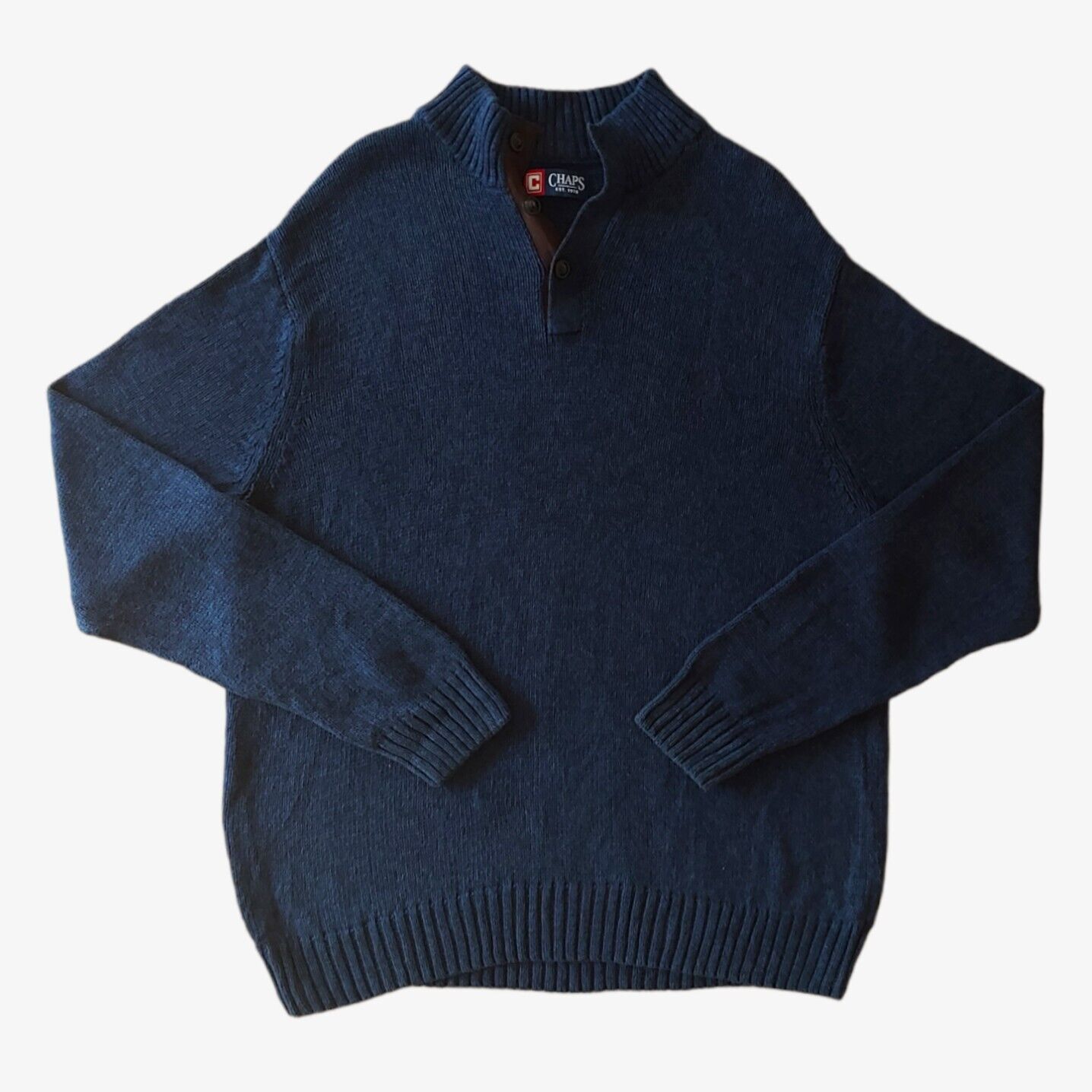 A men's Chaps navy fleece with a ribbed collar and quarter zip front, displayed on a plain background.